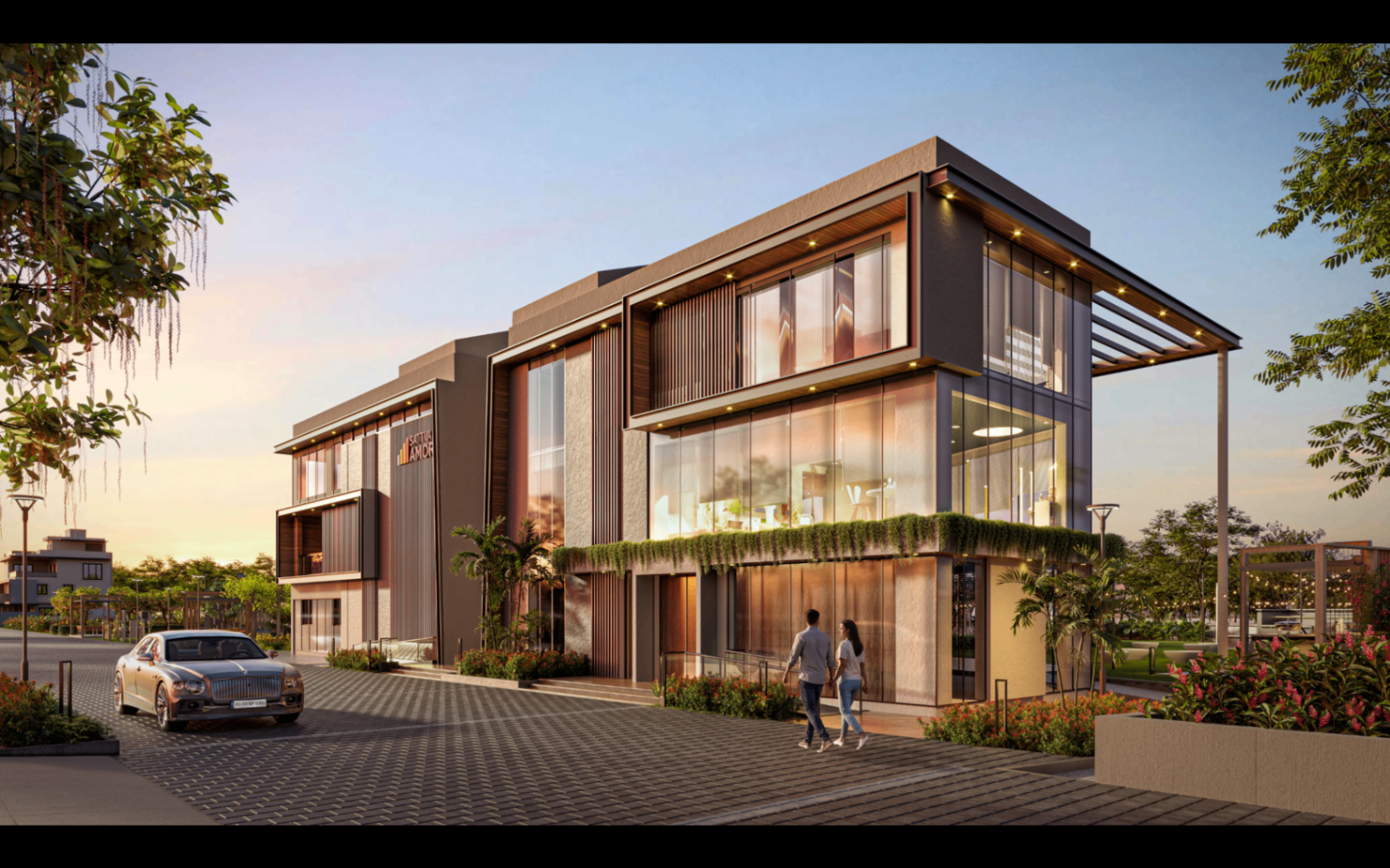 Glass-front clubhouse corner view with arrival plaza landscaping