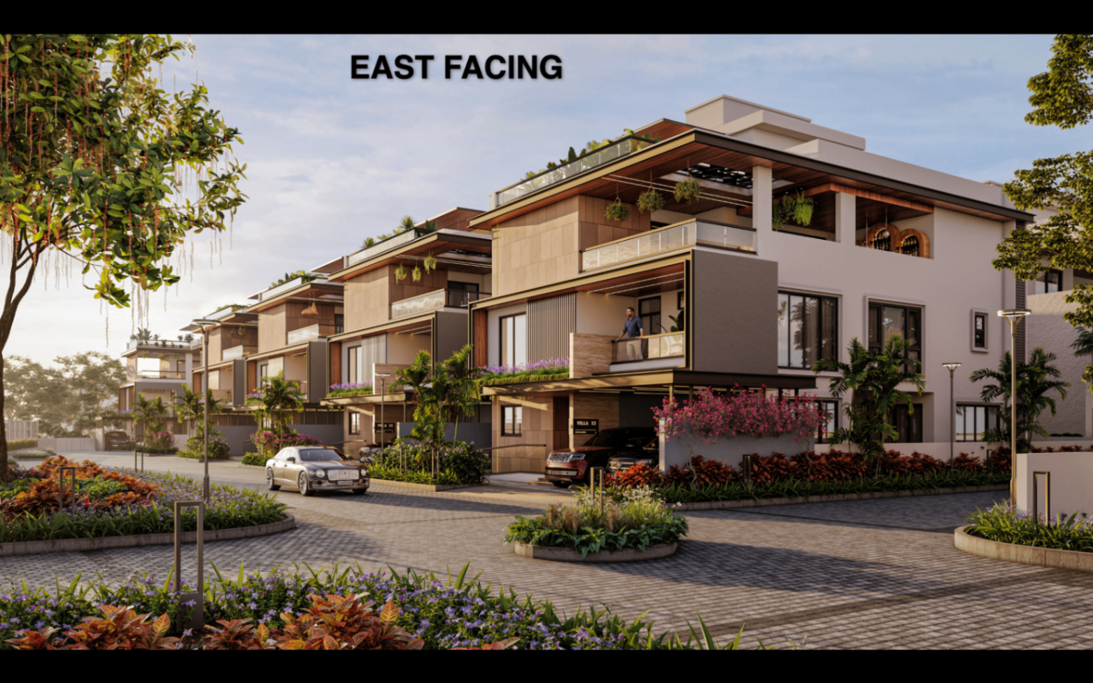 East-facing triplex villa row with landscaped street court at Satva Amora