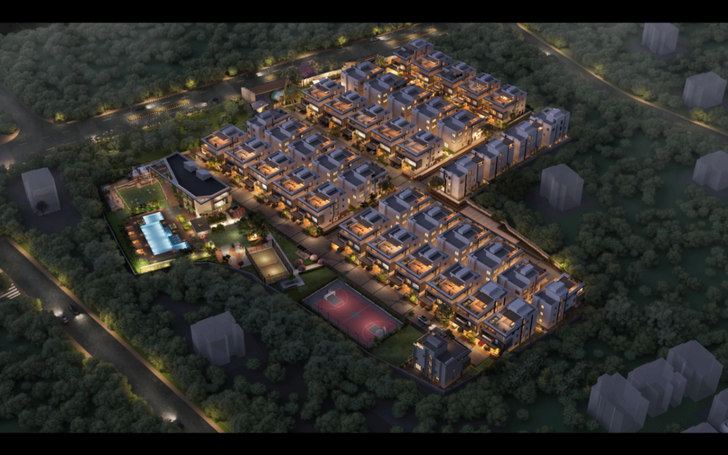 Evening aerial view of the illuminated Sattva Amora masterplan